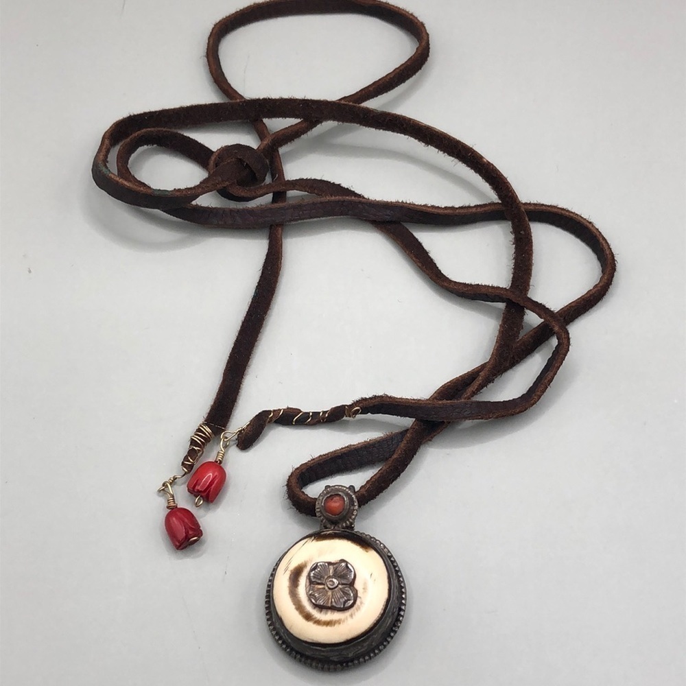 Artisan 2 sided sterling and bone leather cord and coral tie necklace.